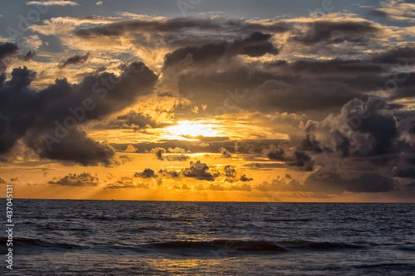 Obraz Pre-monsoon clouds during evening over a beach