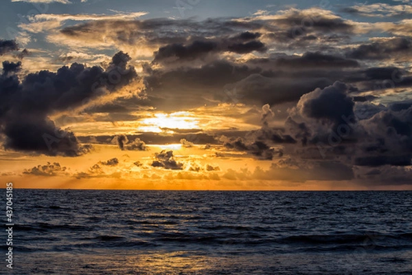 Fototapeta Clouds over a beach during pre-monsoon