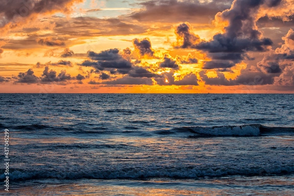 Fototapeta Clouds over a beach during pre-monsoon