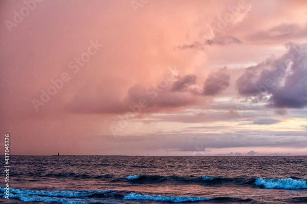 Fototapeta Clouds over a beach during pre-monsoon