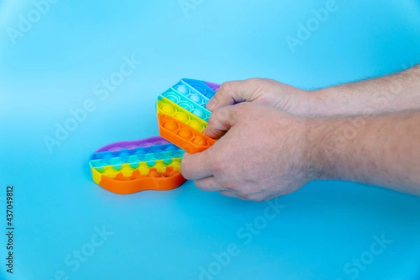 Obraz colorful silicone antistress sensory toy fidget push pop it
