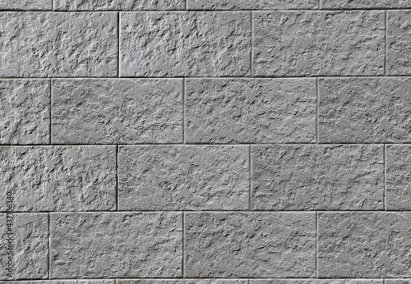Fototapeta Texture of a decorative stone wall made of gray rectangular blocks