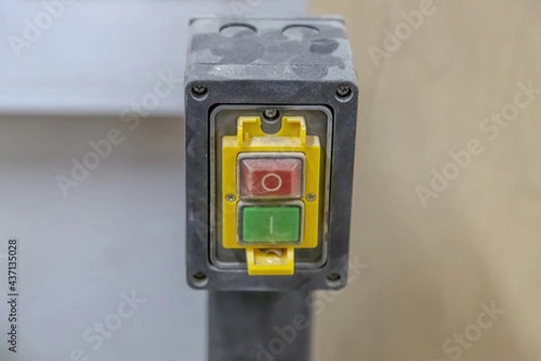 Fototapeta Electrical switch with buttons for turning off and on the machine and industrial equipment