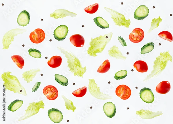 Fototapeta Organic salad ingredients - cherry tomato, cucumber, green salad flying and falling on white wall. Vegetables seamless pattern.