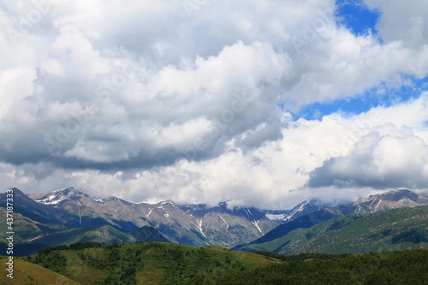 Obraz clouds over the mountains with snow