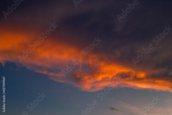 Fototapeta The blurred abstract background of the morning sun exposure to the tiny dust particles that surround the tall buildings in the capital, the long-term health issue of pollution.