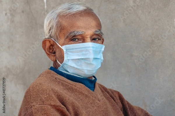 Obraz Portrait of an Old Indian man with mask staring at the camera, during corona virus pandemic in 2021