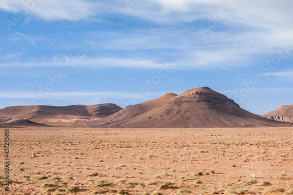 Fototapeta desert and magnificent Atlas mountains landscape graphic layers of rock form seductive curves