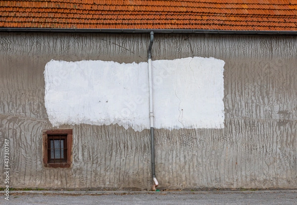 Obraz Hauswand mit weißer Farbfläche