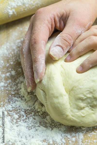 Obraz Manual kneading of dough for cooking homemade food.