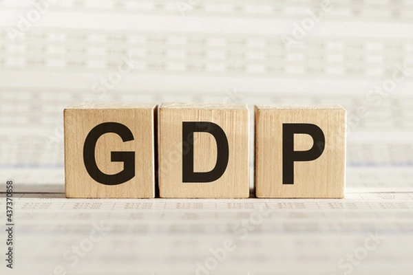 Obraz GDP abbreviation - gross domestic product, on wooden cubes on a light background.