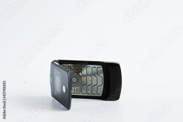 Fototapeta A flip cover model from the first generation mobile phones from the 90's.