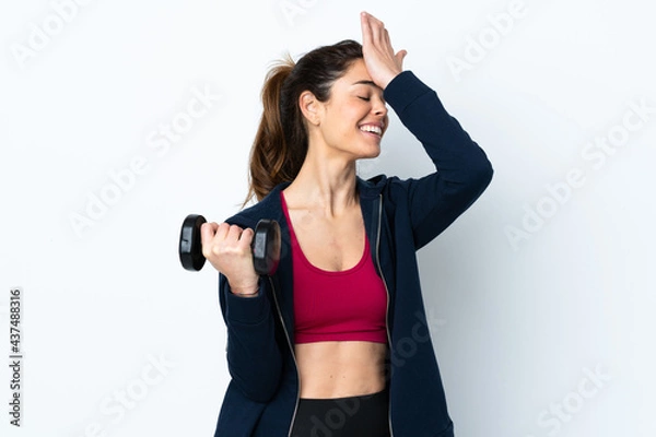 Obraz Sport woman making weightlifting over isolated white background has realized something and intending the solution