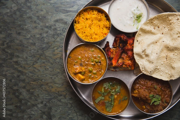 Obraz Typical curry set meal of meals south India with Chicken Tandoori, Mutton Curry, Subji (Vegetarian Curry),Papadum,Nan,Raita (Yogurt with cucumber),Mutter Paneer ,and Pulao Rice
