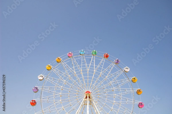 Obraz ferris wheel on a blue sky