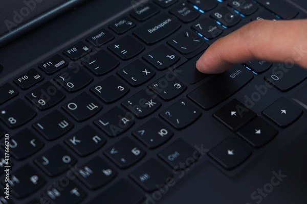 Fototapeta person presses the enter button