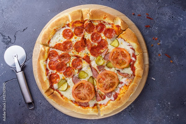 Obraz Pepperoni pizza and sausage pizza on the same board.