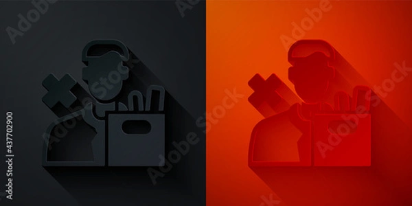 Fototapeta Paper cut Dismissed sad young man carrying box with his personal belonging leaving his job icon isolated on black and red background. Employee fired from work. Paper art style. Vector