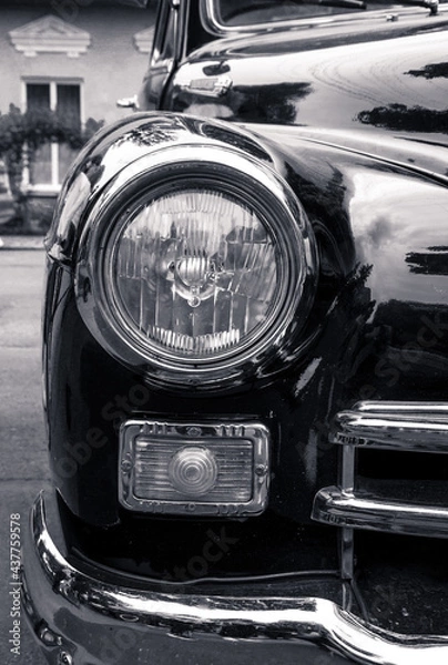 Obraz Retro car festival. Retro car headlight. Fragment of the front of a retro car.