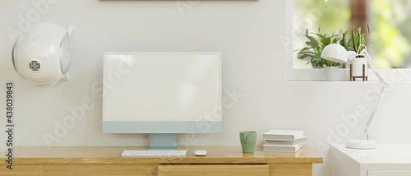 Fototapeta Computer monitor with mock-up screen on wooden table in home office room, 3D rendering