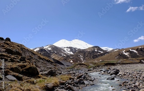 Fototapeta Mountain tourism in the Caucasus. Wonderful views of peaks, gorges, streams.