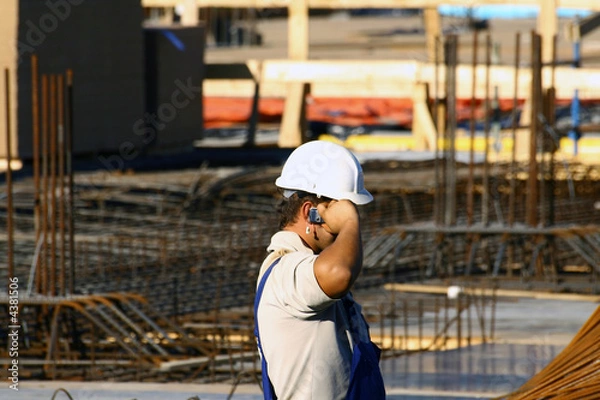 Obraz Speaking mobile on a constructions