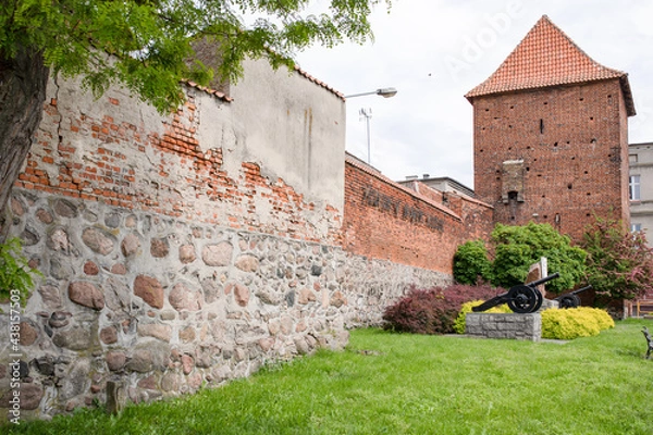 Fototapeta Nowe Miasto Lubawskie, Poland - Fragments of ramparts and a Gothic gate, Medieval architecture.