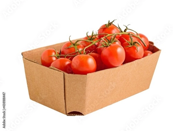 Fototapeta A box of red ripe tomatoes in a cardboard box isolated on a white background