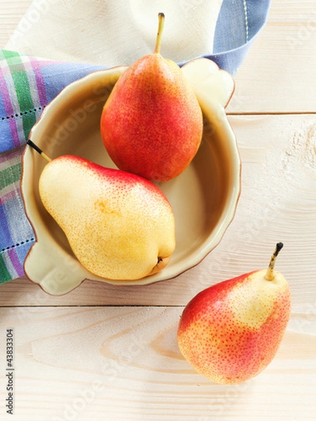 Obraz Fresh pears on a wooden table