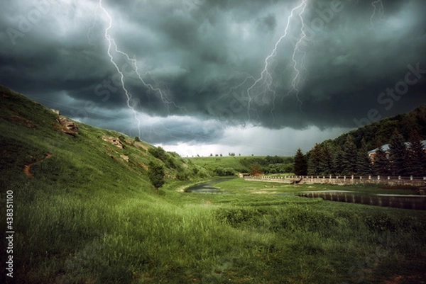 Obraz storm clouds over the mountains