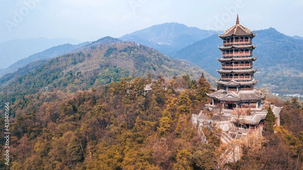 Fototapeta Aerial drone point of view of Dujiangyan, Chengdu, Sichuan, China. Mountain Qingcheng in the summer morning. Spin around up behind the woods mountain with pagoda tower on the hill top. Worship place