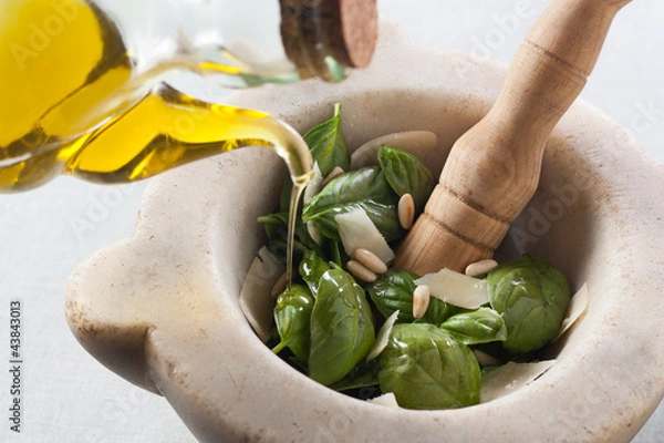 Obraz Making pesto with a mortar