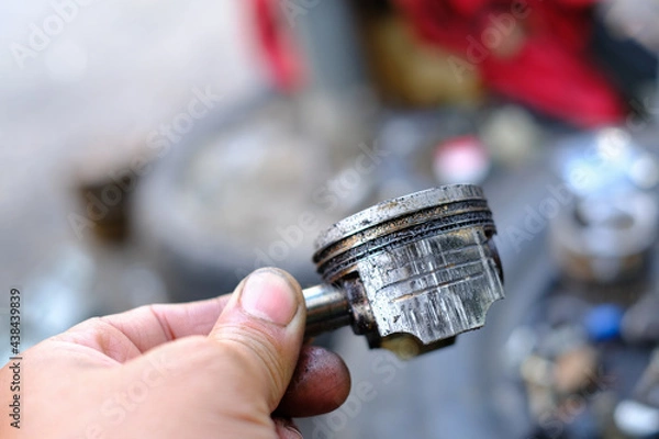 Obraz Damaged motorcycle engine piston rings from use.