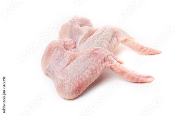 Obraz Raw chicken wings with skin on a white background.