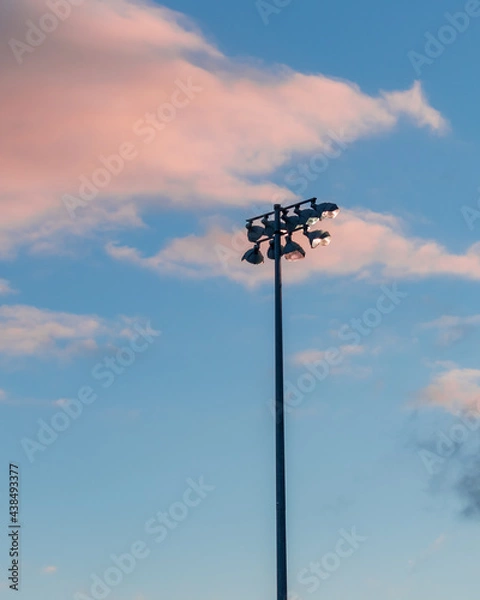 Fototapeta stadium light at sunset