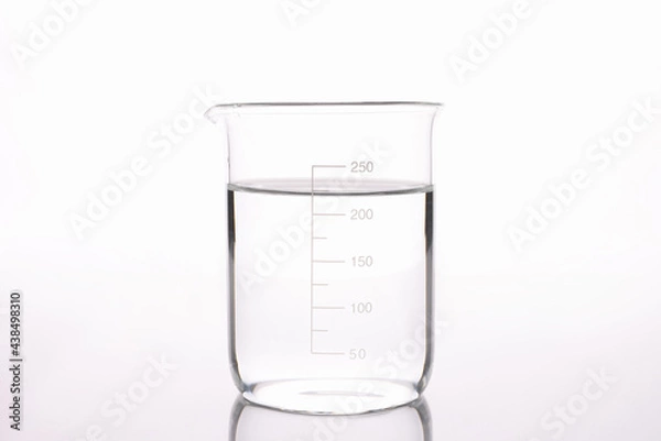 Fototapeta Sterilized water is poured into measuring glass closeup