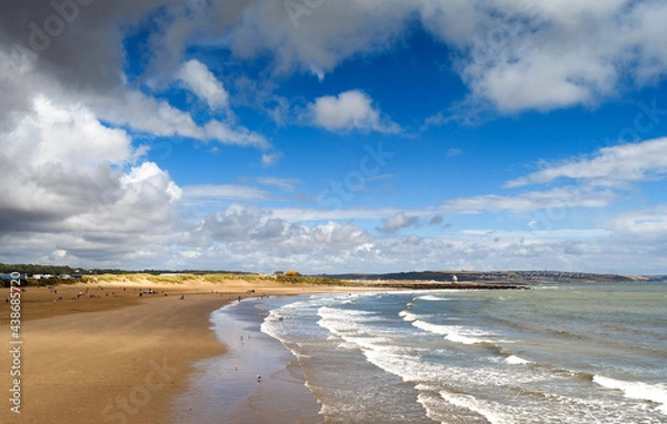 Fototapeta Coney Beach in Porthcawl in South Wales at low tide. It is one of two beaches in the town, which looks out onto the Bristol Channel.