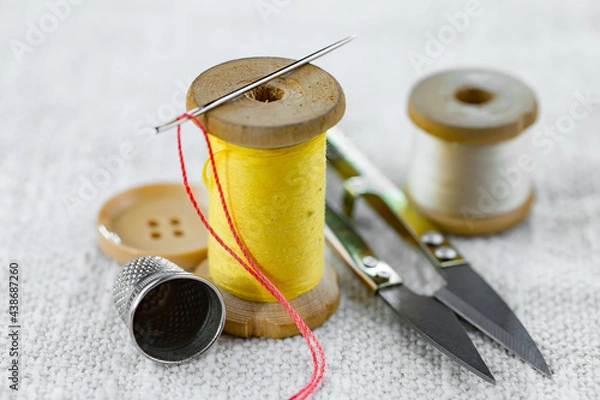 Fototapeta Handicraft items, threads, sewing needles.