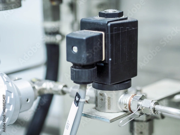 Fototapeta Solenoid valve of water pipe line in sampling analyzer room at power plant.
