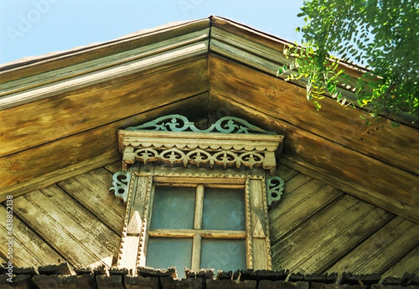 Obraz Pediment with decor. Part of an old Russian wooden house.