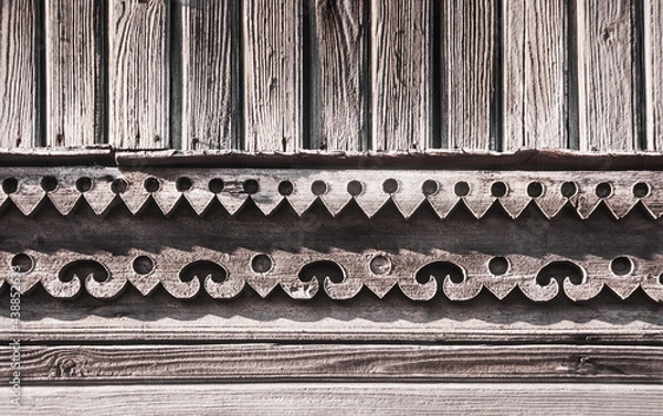 Obraz Carved details of the facade of an old Russian wooden house from the times of the Russian Empire.