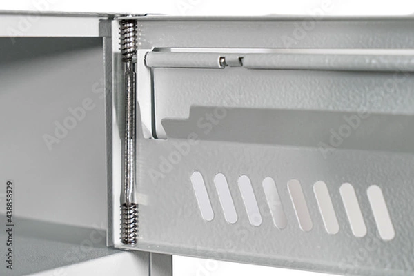 Fototapeta Fragment of the door of metal lockers for locker room. Change room metal locker box on the white background isolated.