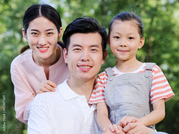 Obraz Happy family of three playing in the park