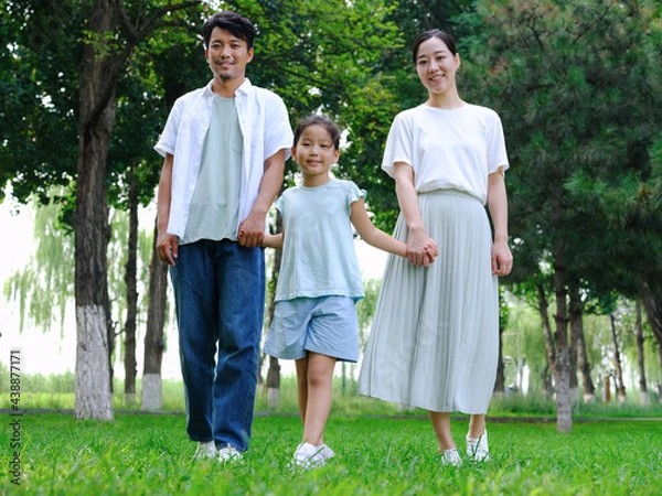 Obraz Happy family of three playing in the park