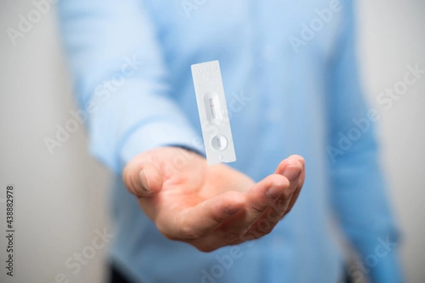Fototapeta Showing corona covid-19 negative self-test at home