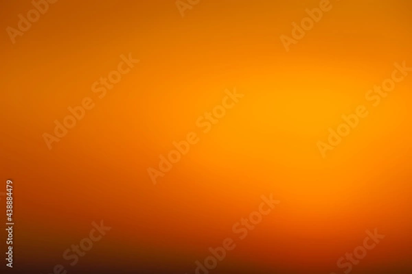 Fototapeta Blurred sunset sky. Abstract orange gradient color as a background