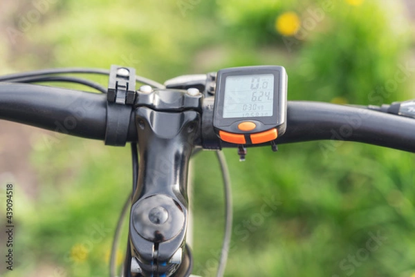 Fototapeta Bicycle computer mounted on a bicycle handlebar