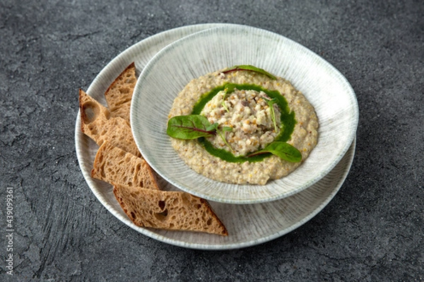 Fototapeta Eggplant, zucchini, mustard seeds and vegetables appetizer. Ready menu for the restaurant. Neutral gray blue textured background