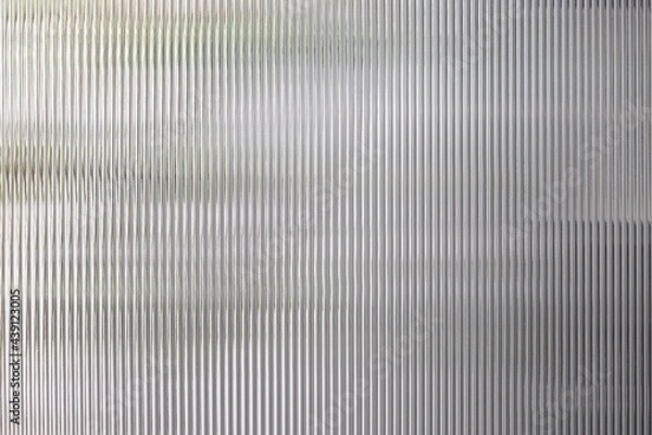 Fototapeta polycarbonate plastic background and texture. Transparent material Corrugated plastic surface use for partition wall or roofing.