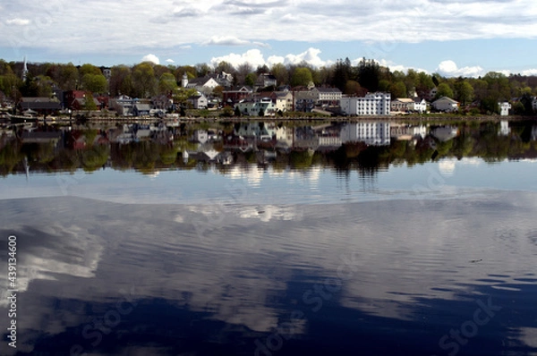 Obraz Bucksport ME, Maine Photo taken from the other side of the Penobscot River.  The clouds in the sky are visibly reflected on the river below.